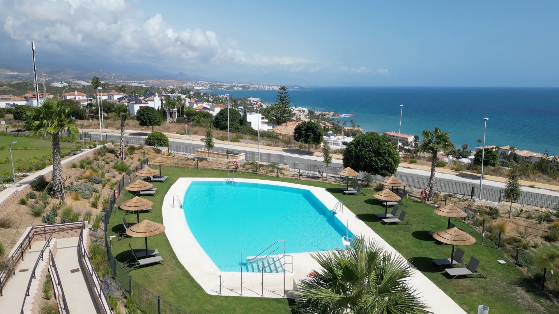 One of the two community pools, looking out to sea